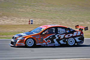 a shutter speed of 1/400 sec, combined with panning the camera provide a sense of speed