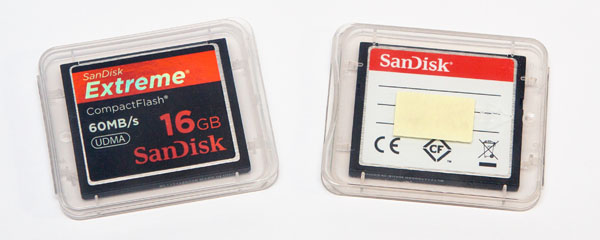 two empty memory cards in their cases (front of memory cards facing AWAY from the label)