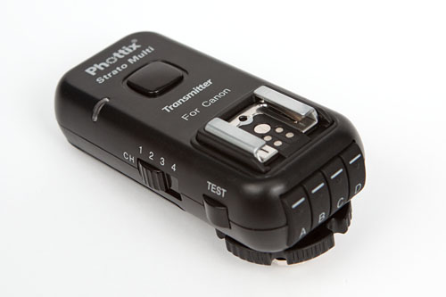Strato II Multi transmitter, showing hot-shoe, channel switch, test button, group buttons