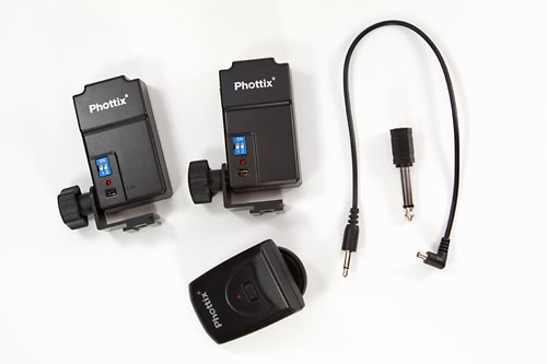 components: 2 receivers, one transmitter, sync cable, and adaptor
