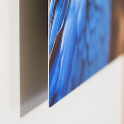 thin aluminum panel, held off the wall by the box mount