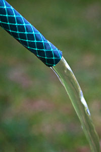 water flowing out of a garden hose