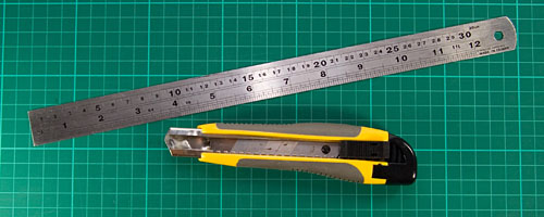 cutting board, ruler and knife