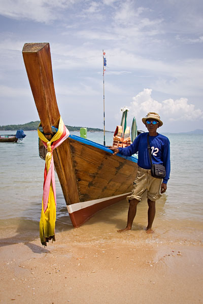 long-tail boat and driver