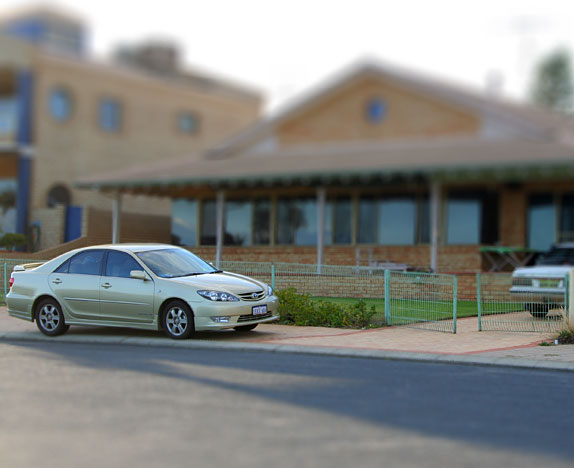 Camry in front of house - tilt-shifted