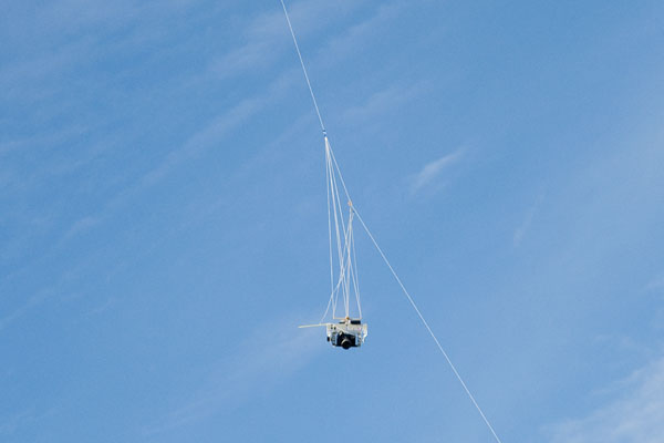 camera rig hanging from kite line