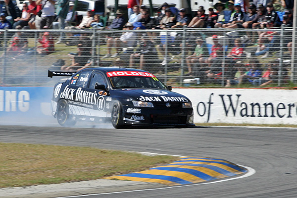 Jack Perkins locking up a front wheel in his Jack Daniel's Racing VE Commodore