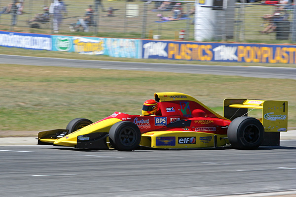 Formula 3000 car sprinting around the track