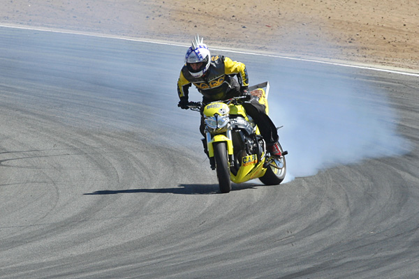 CAPA stunt rider drifting around a corner