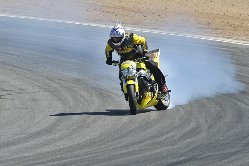 CAPA stunt rider drifting around a corner
