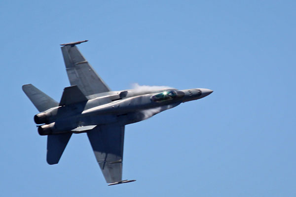 RAAF F/A18 Hornet and vapour on the leading edges
