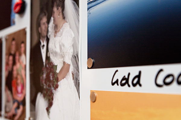 small magnets in each corner of the photos