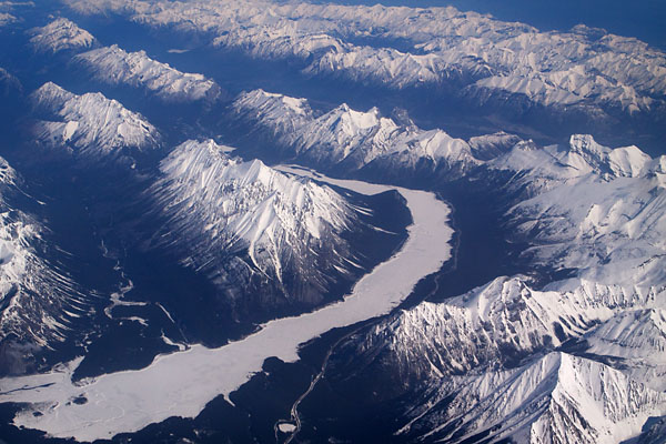 frozen river and snowy Rockies