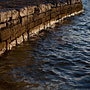 setting sun lights up a rock wall