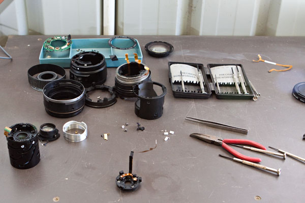 disassembled, with the aperture diaphragm assembly in the foreground