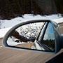 snow-covered mountains in the mirror