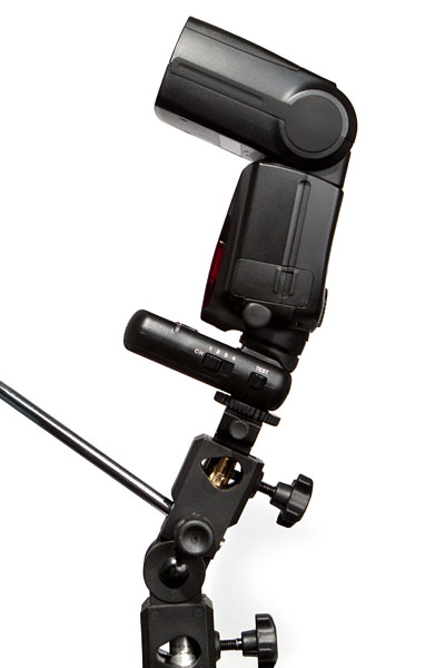 Canon 580EX II flash on a transmitter on a light stand