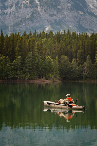fly fisherman in his kayak