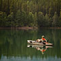 fly fisherman in his kayak