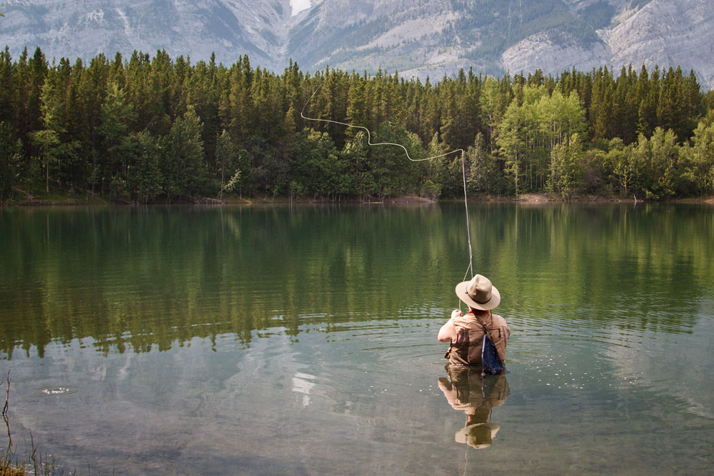 fly fisherman casting