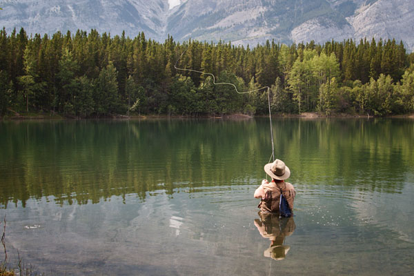 fly fisherman casting