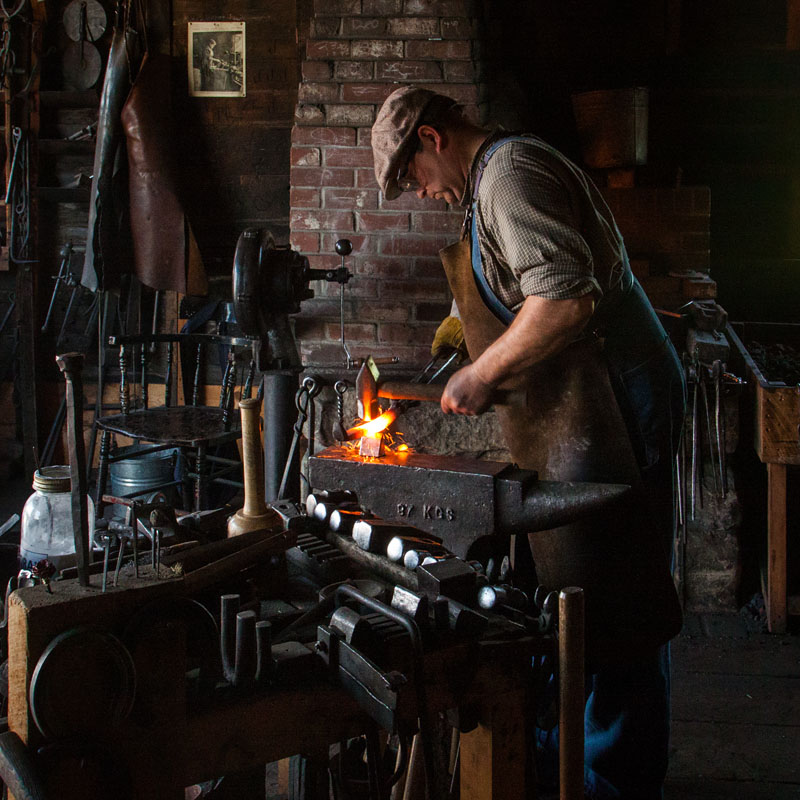 blacksmith shaping hot metal