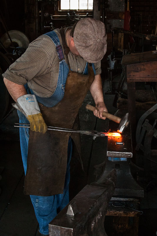 blacksmith shaping hot metal