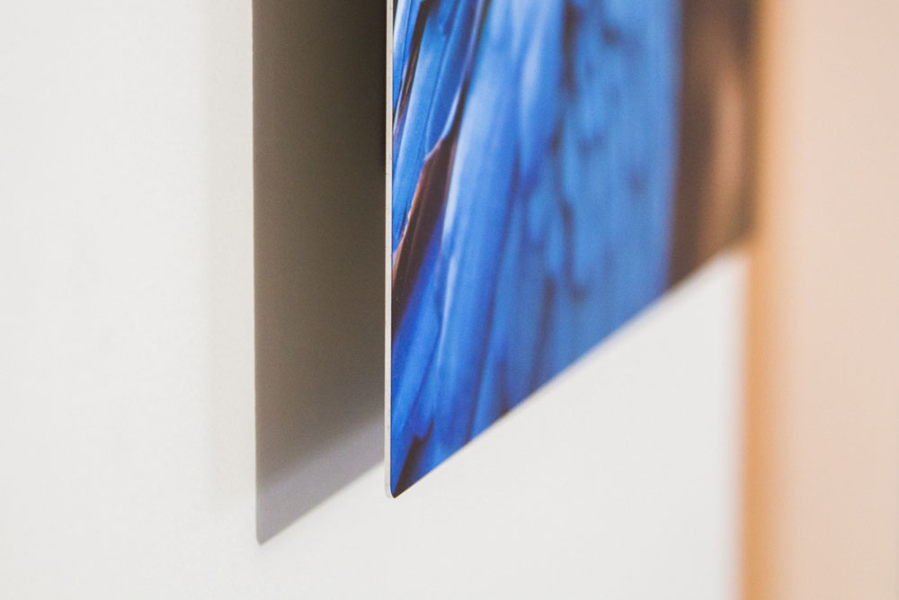 thin aluminum panel, held off the wall by the box mount