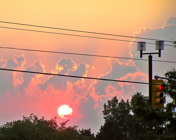 Angry sunset behind power lines