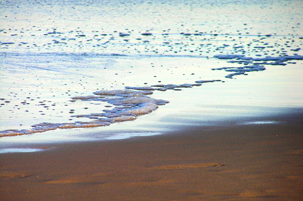receeding waves on the beach