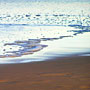 receeding waves on the beach