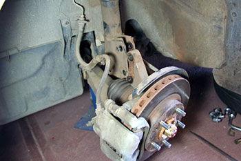 after removal of the brake line, ABS wiring and strut-to-steering knuckle bolts